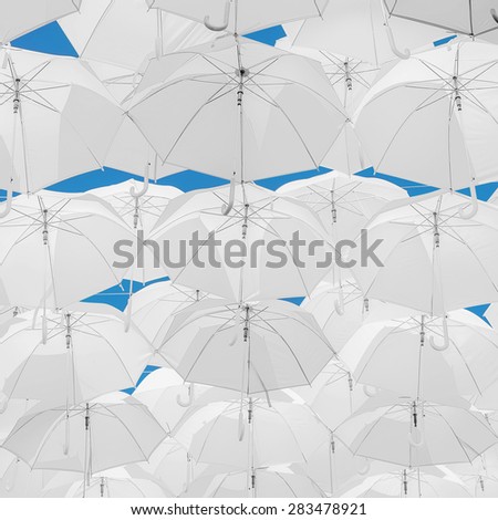 A lot of white umbrellas. White umbrellas urban decoration.