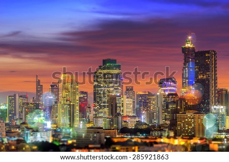 Bangkok business district during twilight sky dramatic with blurred light, Concept combines multiple exposures with bokeh.