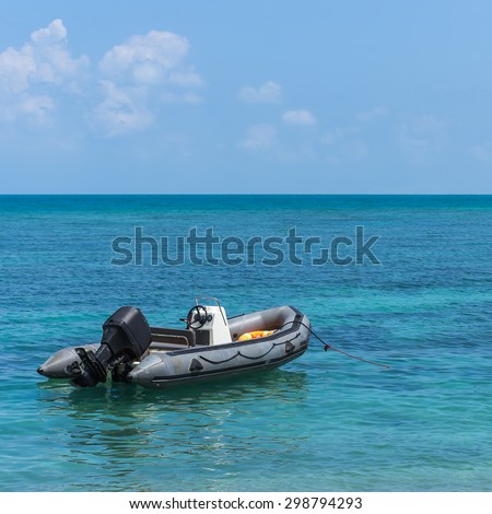 Inflatable boat moored at the coast clear, Chonburi, Thailand.