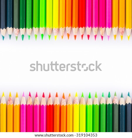 Colorful wooden crayon on white background.