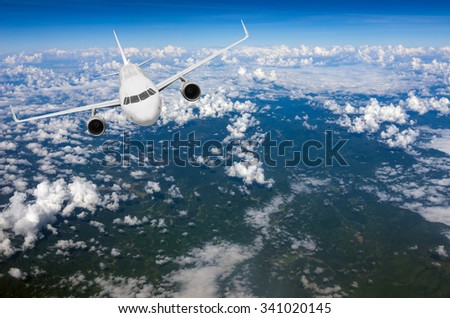 The view from the plane of the world under a cloud.