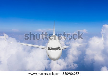 Airplane flying high above the clouds.