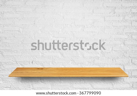 Top wooden shelves and brick wall background - For product display.