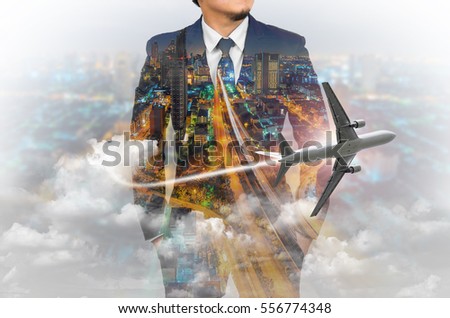 Double exposure of businessman wearing suit with Skyscraper background and airplane.