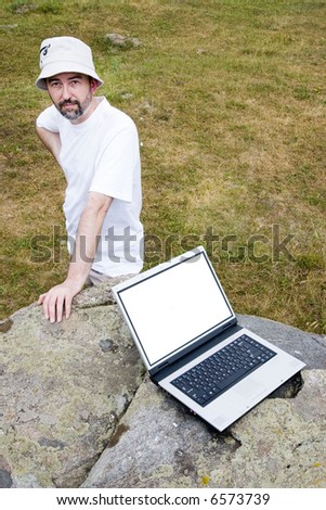 sad man and  his laptop with empty screen for the text inserting