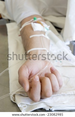 close up of a patient\'s hand with intravenous injection