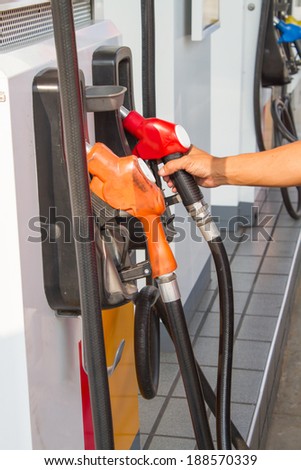 fuel nozzle at Petrol pump filling