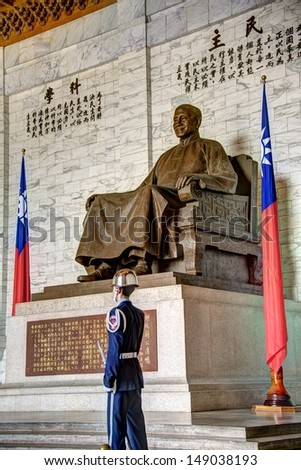 TAIPEI, TAIWAN - JULY 23: A large bronze statue of Chiang Kai-shek on July 23, 2013 in Taipei, Taiwan. This huge bronze statue dominates the main hall of the CKS memorial hall in Taipei, Taiwan.