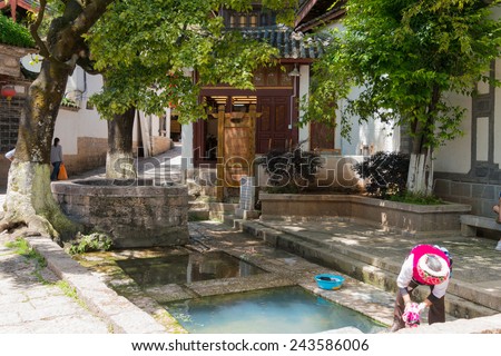 LIJIANG, CHINA - SEP 5 2014: Sanvan Well at Old Town of Lijiang(UNESCO World heritage site). a famous landmark in Lijiang, Yunnan, China.