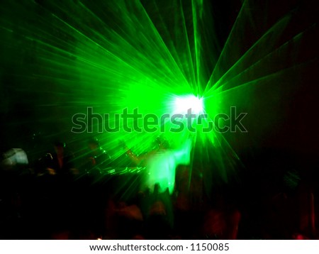 A laser moving throught the stage on a DJ performance