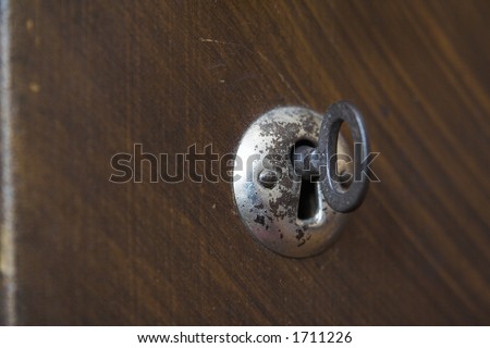 Old Key Hole. Key Hole with a key