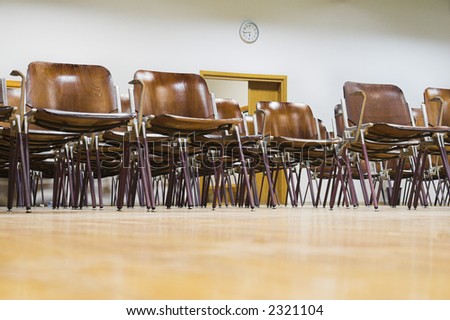 Empty classroom. Clock and open door in empty university classroom without students