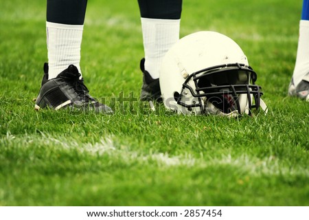American football equipment - helmet. Sport concept. Football player boots