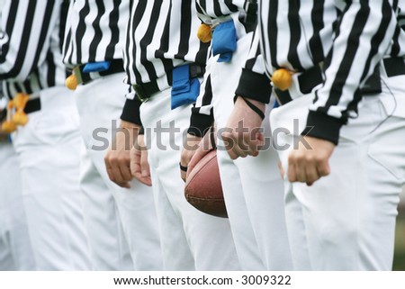 American football referee holding ball. American football concept