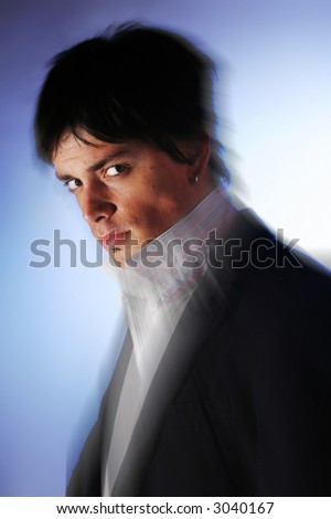Elegant fashion man model. Handsome young man look. Charismatic face in zoom blur