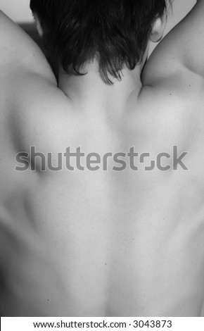 Back of a muscular man body. Black and white body skin
