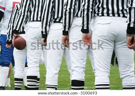 American football referee holding ball. American football concept