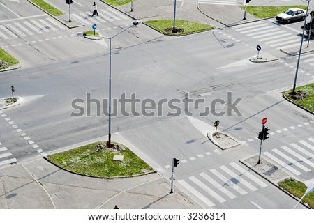 Street crossroad from above. Traffic lights and city traffic