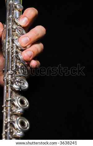 Flute in hands - music background. Classic music concert concept
