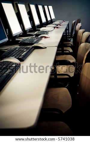 Computer classroom. Computers in line in school classroom. Information technology concept