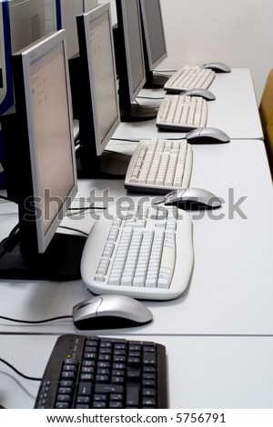 Computer classroom. Computers in line in school classroom. Information technology concept