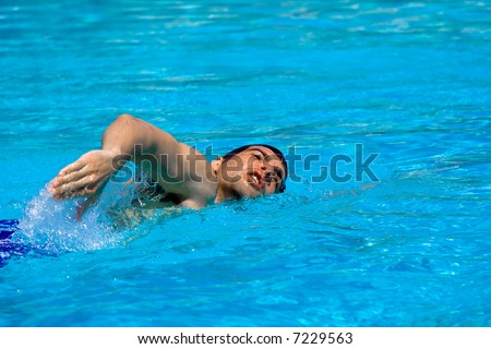 Man swimming in pool. Water sports concept