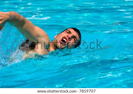 Man swimming in pool. Swim training