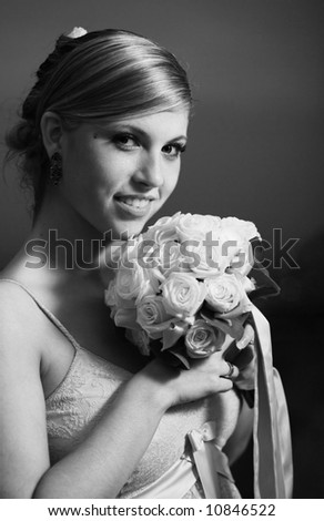 Beautiful the bride portrait with bouquet flowers. Soft dreamy look, sharp eyes and face