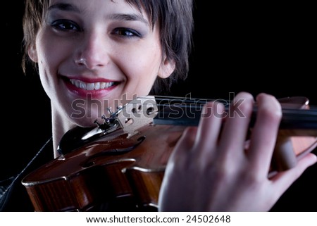 Close up girl playing a violin. Classic Music concept.
