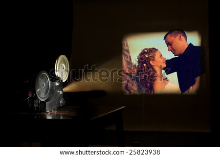 Film projector projecting a movie. Love couple on a screen. Film festival concept