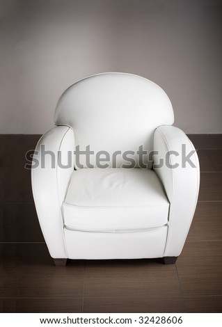 modern leather armchair isolated on gray wall