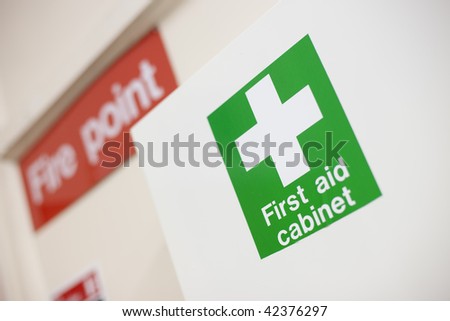 First aid cabinet and fire point label