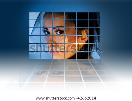 Headshot of a young sexy woman on large video wall. Television production technology concept