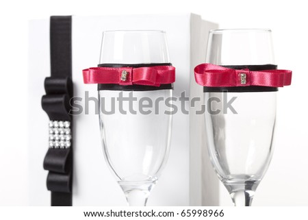stock photo Decorated champagne glasses with a invitation for a wedding in 