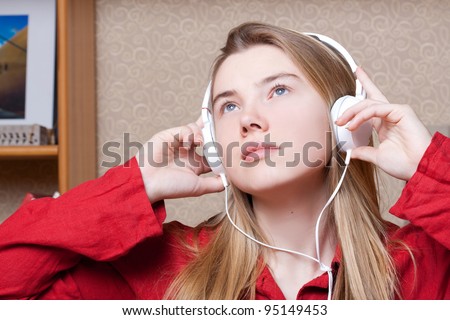 Dreaming girl or headphones woman
