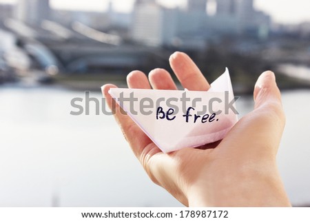 a Paper boat in the hand or Be free. Spring and freedom, beauty of life