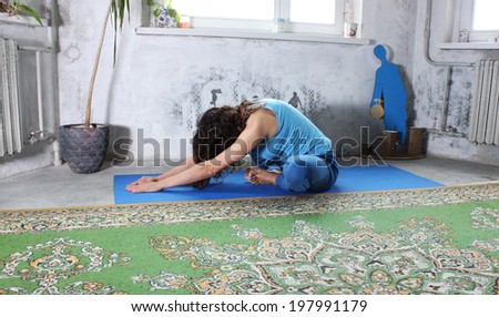 Yoga practice or Yoga at home, a Beautiful young woman doing yoga, Serenity