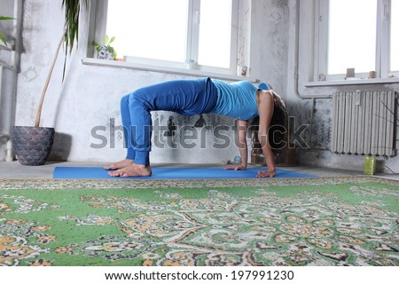Yoga practice or Yoga at home, a Beautiful young woman doing yoga