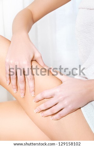 Woman testing her skin showing no problems