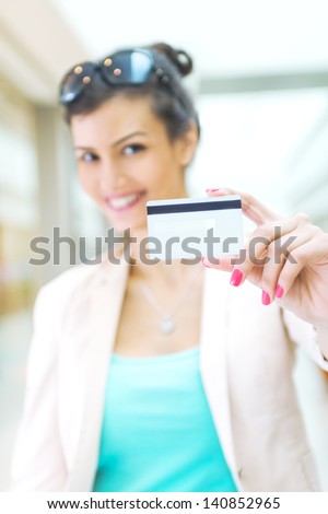 Shopping time, woman with credit card at mall, focus on credit card