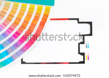 Graphic design and printing concept Pantone palette with printed package leftover