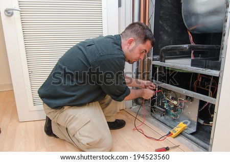 HVAC technician working on a residential heat pump