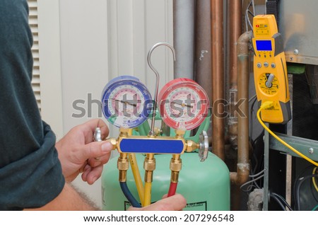 Charging a residential heat pump system with refrigerant