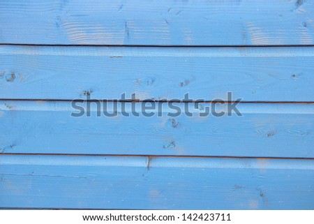 bright blue painted planks of wood