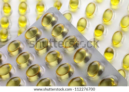 Close up of a pill blister with yellow pills