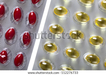 Close up of a pill blister with red and yellow pills