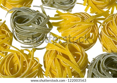 A raw colored pasta isolated on white background