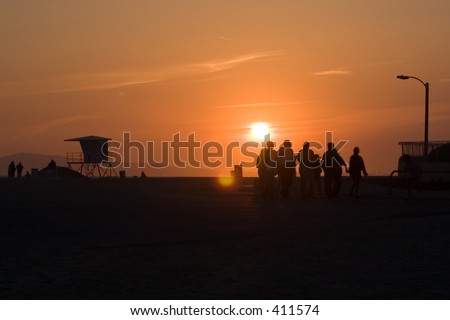 Sunset on beach with people