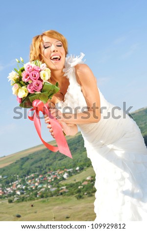 happy bride in a beautiful natural landscape