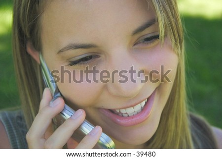 A beautiful young woman on a cell phone.